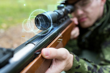 close up of soldier or sniper with gun in forest - obrazy, fototapety, plakaty
