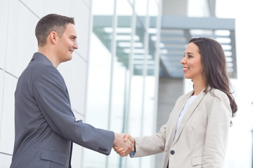 Fototapeta premium Young businesspeople shaking hands