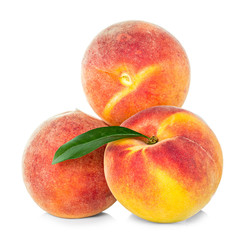 Peaches with leaf isolated on white background