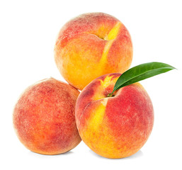 Fototapeta na wymiar Peaches with leaf isolated on white background