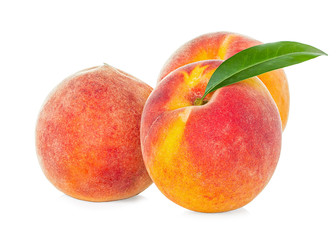 Peaches with leaf isolated on white background