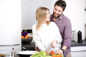 Obraz na płótnie Canvas Happy couple in their kitchen