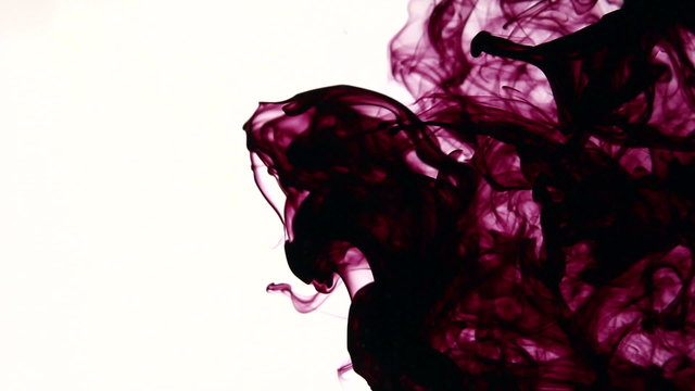 Colored ink cloud grows in water