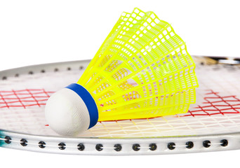 Shuttlecock lying on the badminton racket