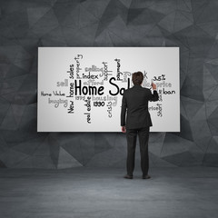 businessman in room drawing home sales on  blackboard