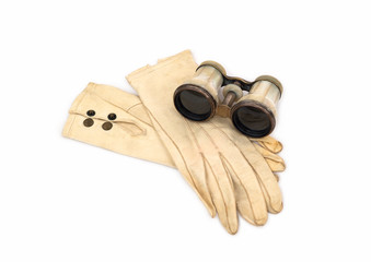 Antique Opera Glasses with Leather Gloves on white background. © Reid Dalland