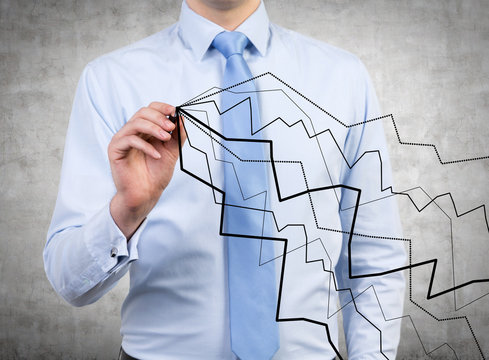 businessman darwing graphs