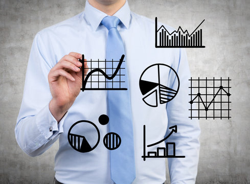 businessman darwing charts