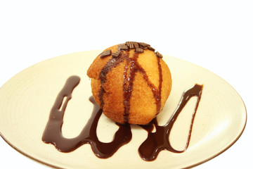 Fried Ice cream with chocolate syrup.