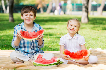 Kids eating watermelon