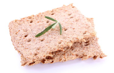 Crispbread with sprigs of rosemary isolated on white background