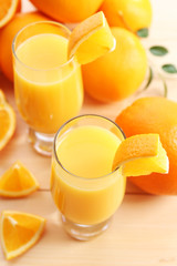 Freshly squeezed orange juice on wooden table