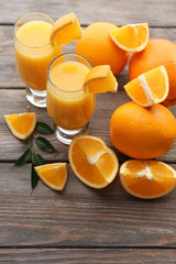 Freshly squeezed orange juice on wooden table