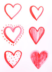 Painted hearts on sheet of paper isolated on white