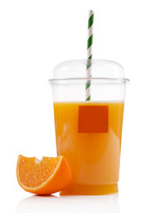 Orange juice in fast food closed cup with tube and slice of