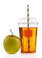 Juice in fast food closed cup with tube and apples isolated