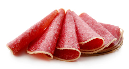 Slices of salami isolated on white background