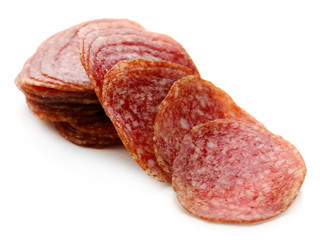 Slices of salami isolated on white