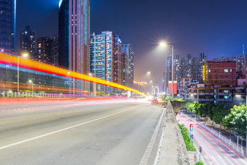 urban traffic night scene with light trails on overpass