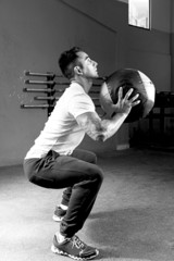 man doing ball slams exercise - crossfit workout.