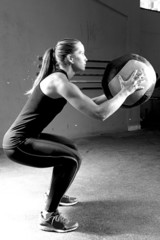 woman doing ball slams exercise - crossfit workout.