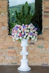 Fototapeta na wymiar Bunch of flowers in a big decorative vase