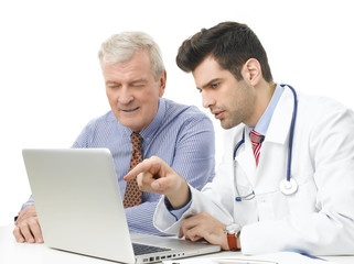 Young male doctor with old patient