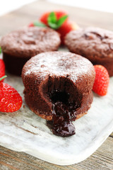 Hot chocolate pudding with fondant centre with strawberries,