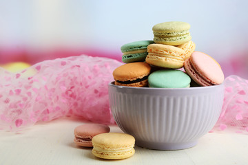 Assortment of gentle colorful macaroons in colorful bowl