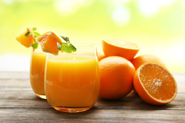 Glass of orange juice and slices