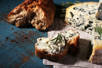 Blue cheese with sprigs of rosemary and bread
