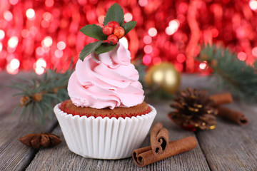 Cup-cake with cream and Christmas decoration