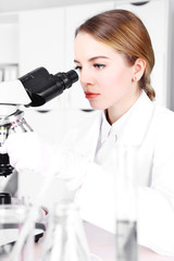 Fototapeta premium Young researcher carrying out scientific research in lab