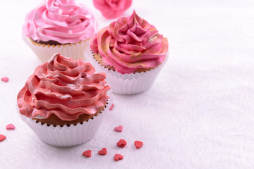 Delicious cupcakes on table close-up