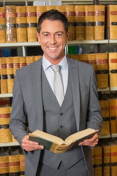 Lawyer reading book in the law library