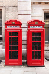 Traditional red telephone booths in London - 75987571