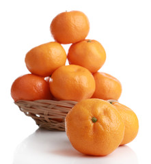 Tangerines in basket isolated on white