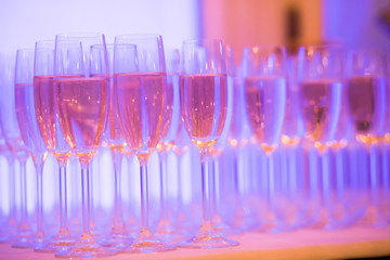 Line of different colored cocktails with smoke on a party
