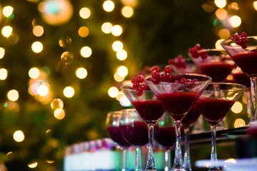 Gordijnen Line of different colored cocktails with smoke on a party © tsuguliev