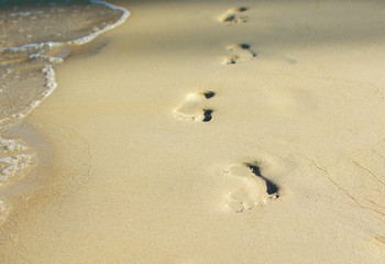 Fototapeta na wymiar Foot prints in the sand