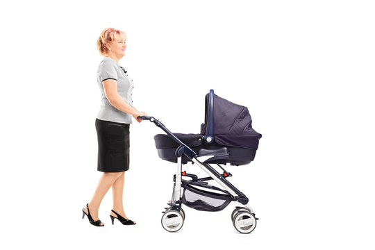 Mature Woman Pushing A Baby Stroller