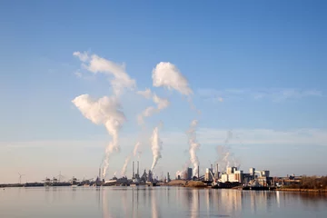 Foto op Plexiglas buildings of Tata steel in the dutch town of IJmuiden © ahavelaar