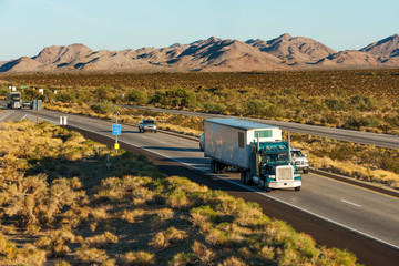 Traffic moving across America on interstate I-10 - Powered by Adobe