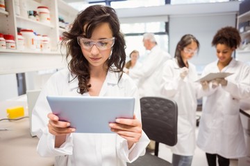 Science student looking at tablet pc