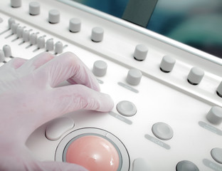 Control panel of medical device with doctor's hand