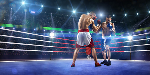 Fototapety  Dwóch zawodowych bokserów walczy na arenie