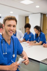 Medical student smiling at the camera during class