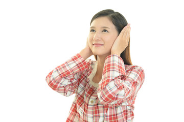 Fototapeta premium 耳を押さえる女性 