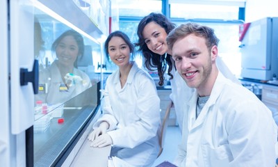 Science students using pipette in the lab