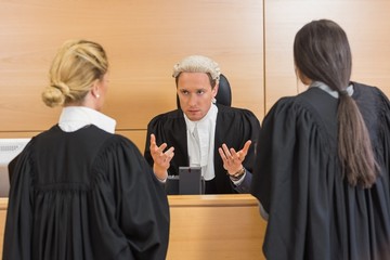 Lawyers speaking with the judge